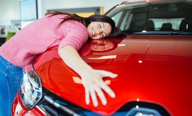 car insurance root insurance app features happy woman hugging red car